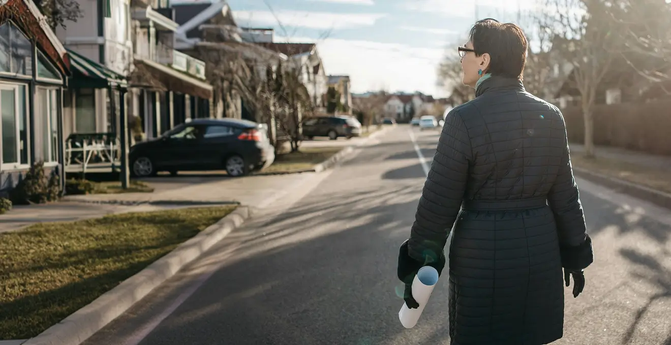 Woman standing in an Oshkosh street