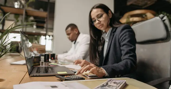 Investors reviewing return on investment data